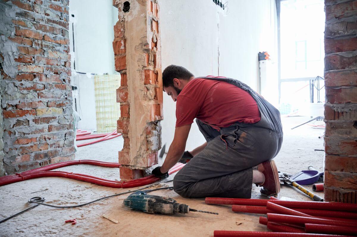 Plumber working on residential pipework